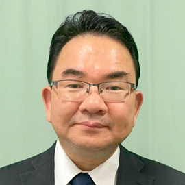 秀明大学 英語情報マネジメント学部  教授（学部長） 大塚 時雄 先生